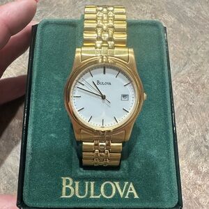New in box Bulova men’s watch in gold tone